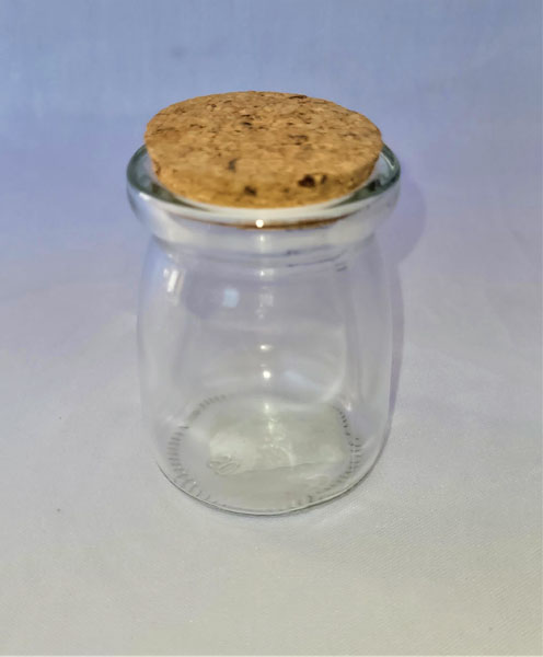 <span style='position: fixed;top: 500px;left: calc( 550px + (100vw - 600px)/2);'></span>
<table width='100%' border='0'>
  <tr>
    <td style='padding: 5px;width: 70%;background-color:#ec0d0d;vertical-align: middle;font-size:35px;height: 102px;border-radius: 20px;'>Small Fat Glass Jar with Cork Lid/ 08</td>
    <td class='watch' align='center' style='position: fixed; background-image:url(assets/price.png);background-size: cover;
    font-size: 45px;
    top: 645px;
    left: calc( 460px + (100vw - 600px)/2);
    width: 245px;
    height: 200px;
    text-align: -webkit-center;
    vertical-align: middle;'><div style='padding-top: 90px;transform: rotate(7deg);'><span>7.00  R</span></div></td>    
  </tr>
</table>